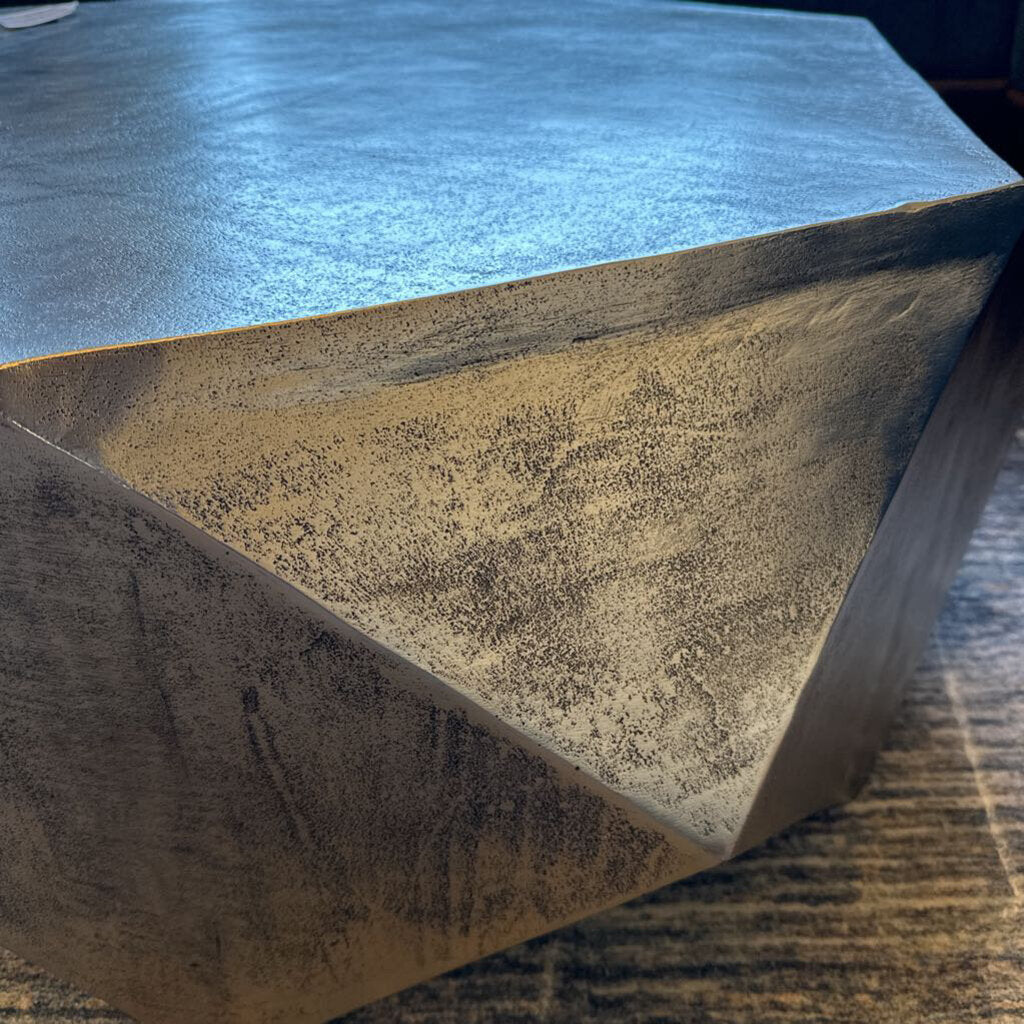 Close-up of a textured stone surface with a blue fabric background