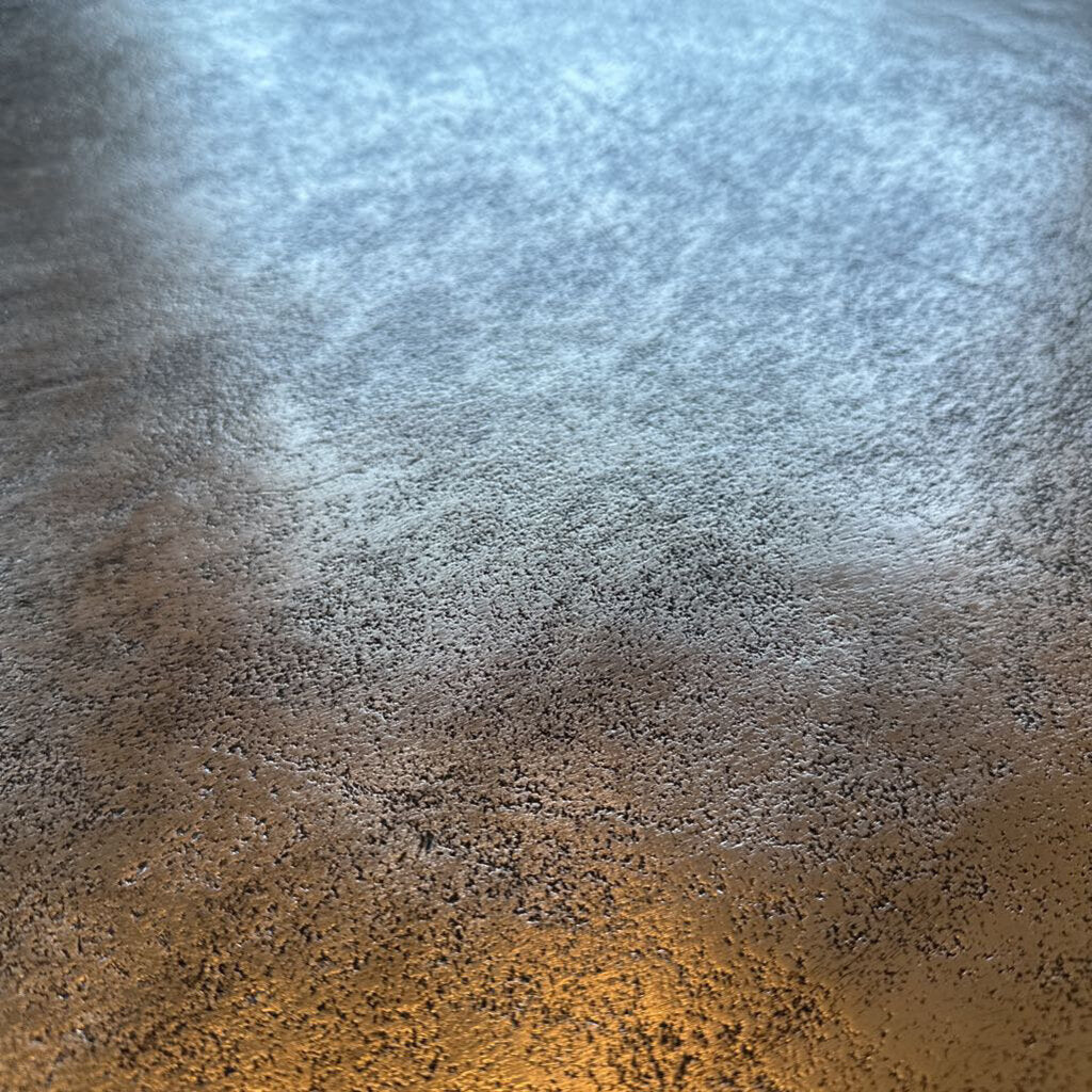 Textured surface with gradient from brown to blue