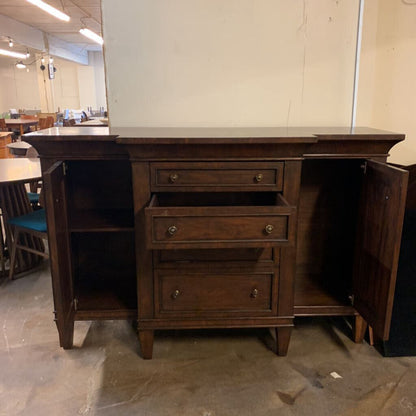 Wooden desk with drawers in a room setting