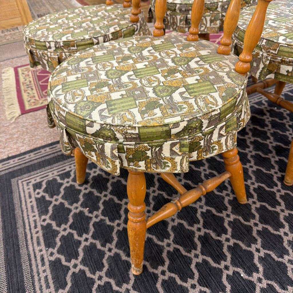 Wooden chair with patterned cushion on a textured rug