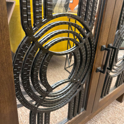 Close-up of a decorative metal gate with intricate designs.