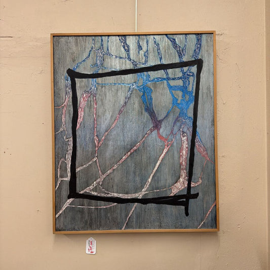 Abstract painting with black, blue, and red lines on a beige wall