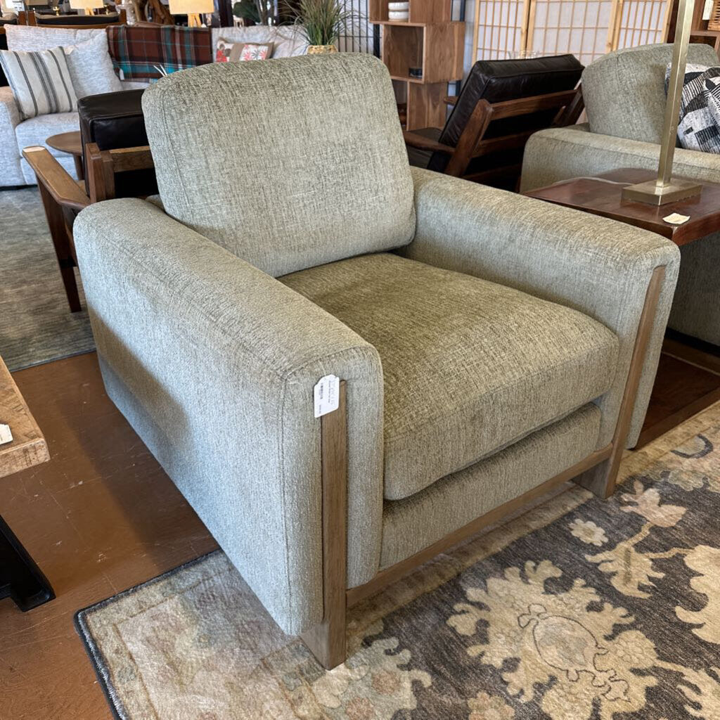 Beige armchair in a room with other furniture