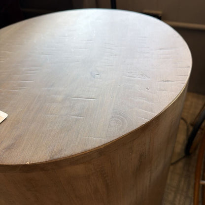 Drum-style end table with smooth cylindrical silhouette