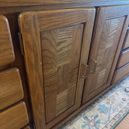 Wooden cabinet with paneled doors on a patterned rug