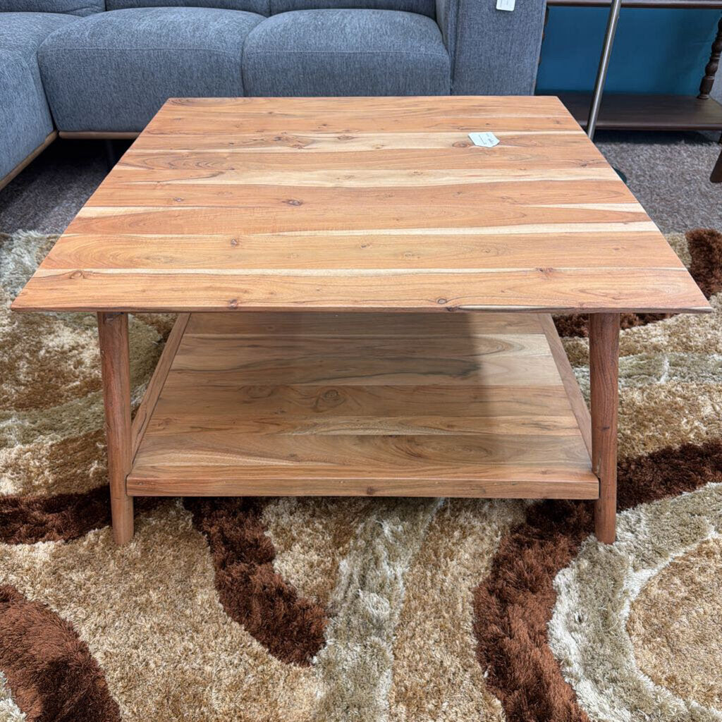Wooden coffee table on a patterned rug