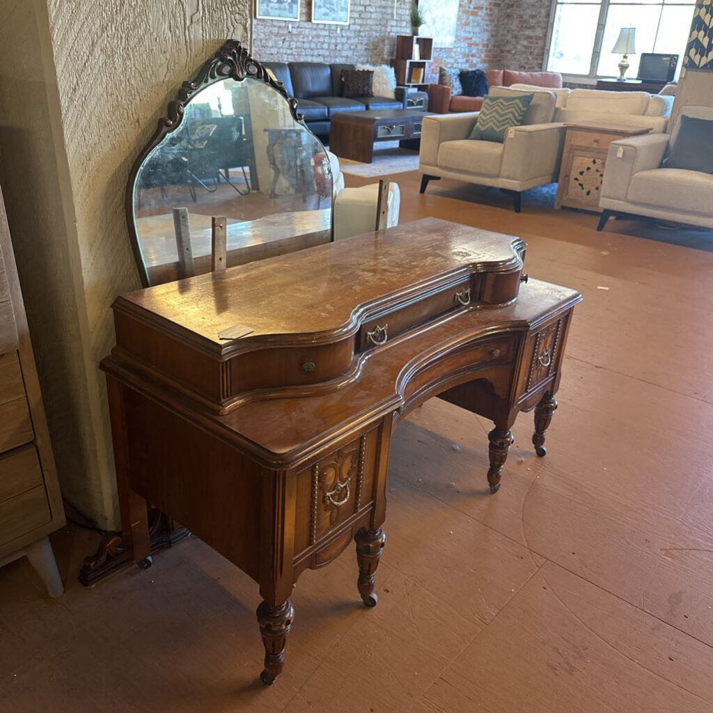 Wooden vanity with mirror in a living room setting