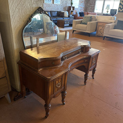 Wooden vanity with mirror in a living room setting