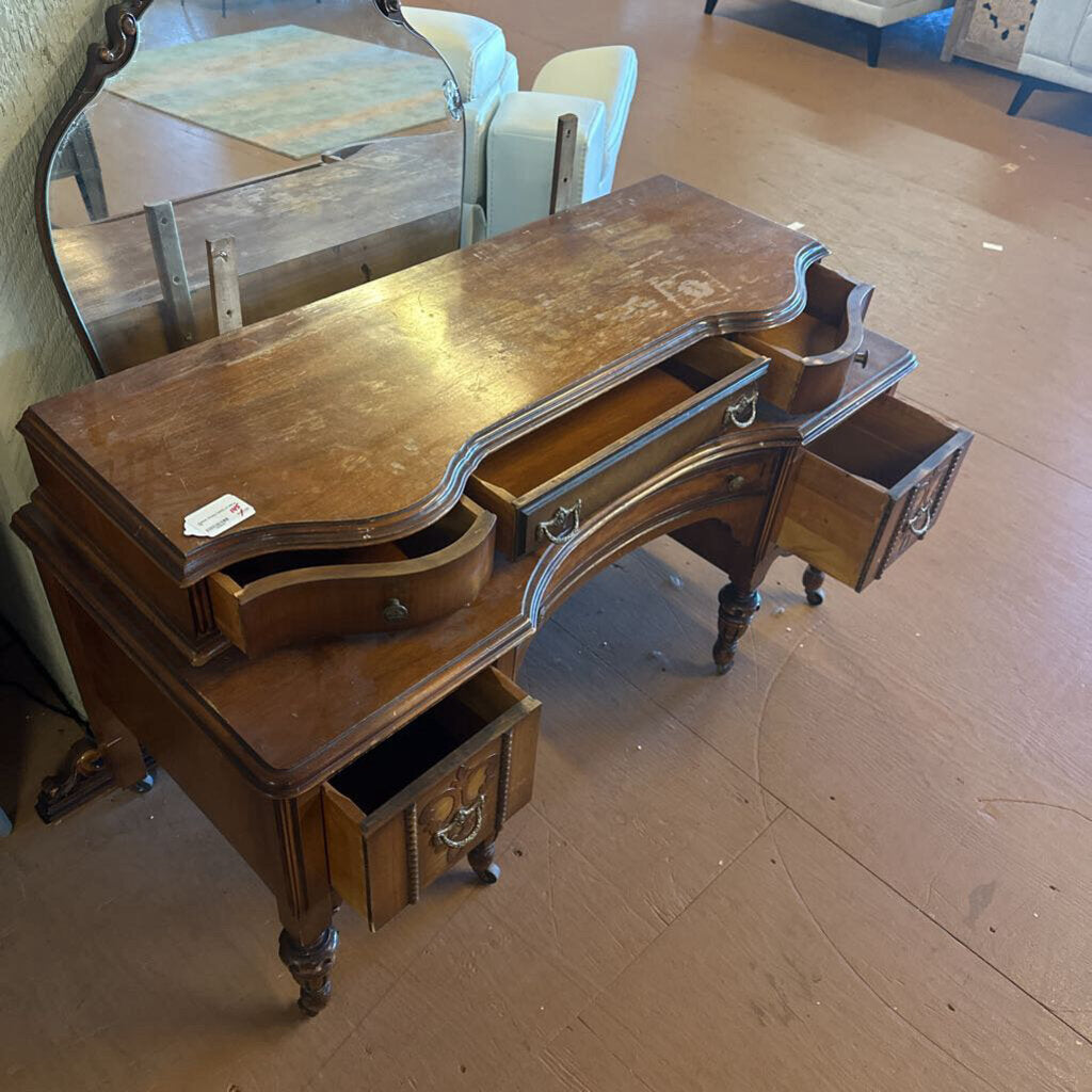 Wooden vanity with mirror on a wooden floor