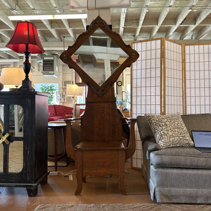 Wooden mirror with red lampshade in a room with furniture and decor
