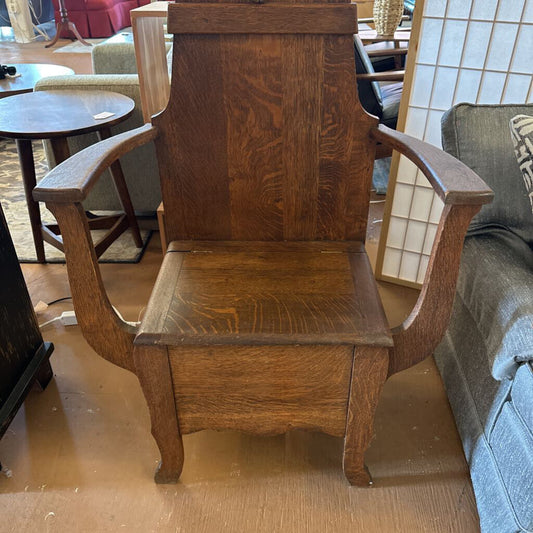 Wooden armchair in a room with furniture and decor