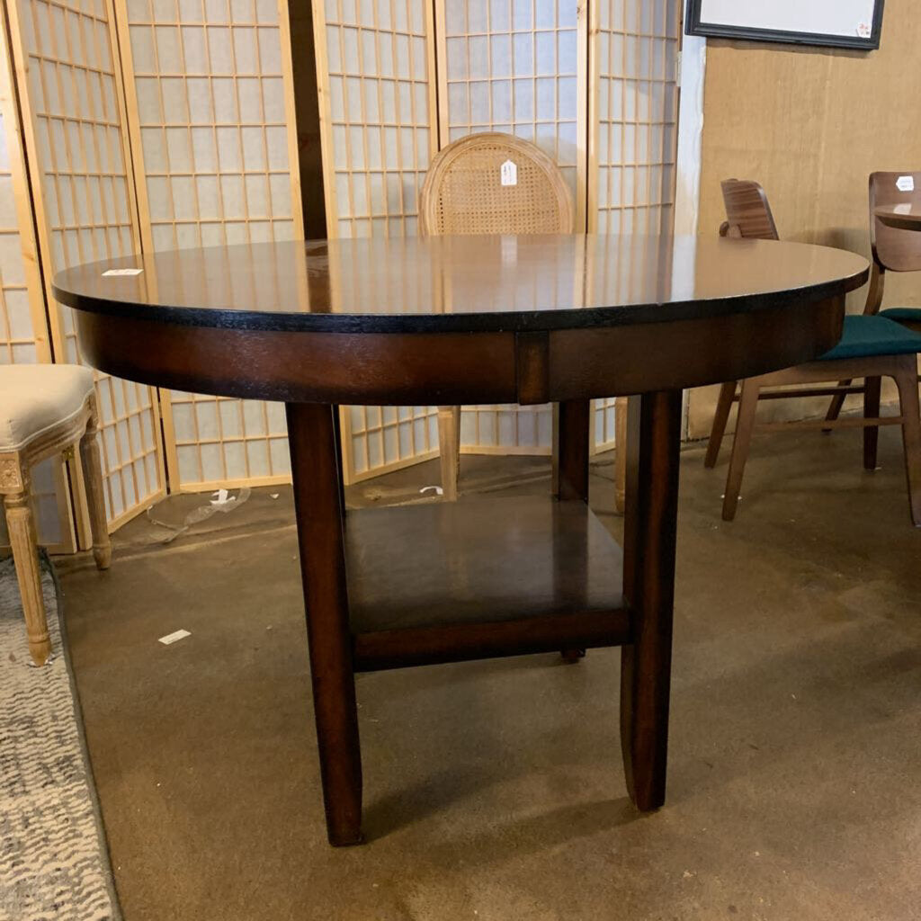 Wooden dining table with chairs in a room setting