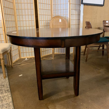 Wooden dining table with chairs in a room setting