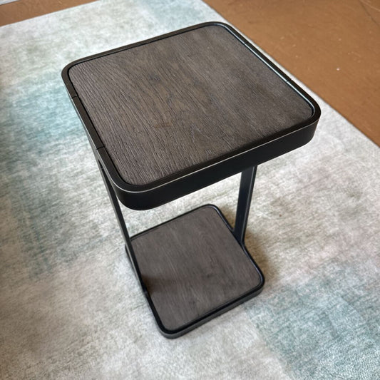 Small wooden stool on a textured surface