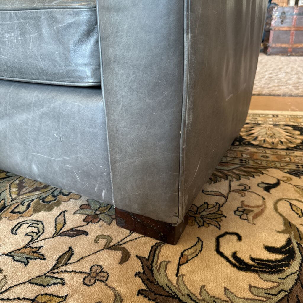 Gray sofa on a patterned rug