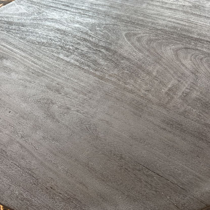 Close-up of a gray wooden surface with visible grain.