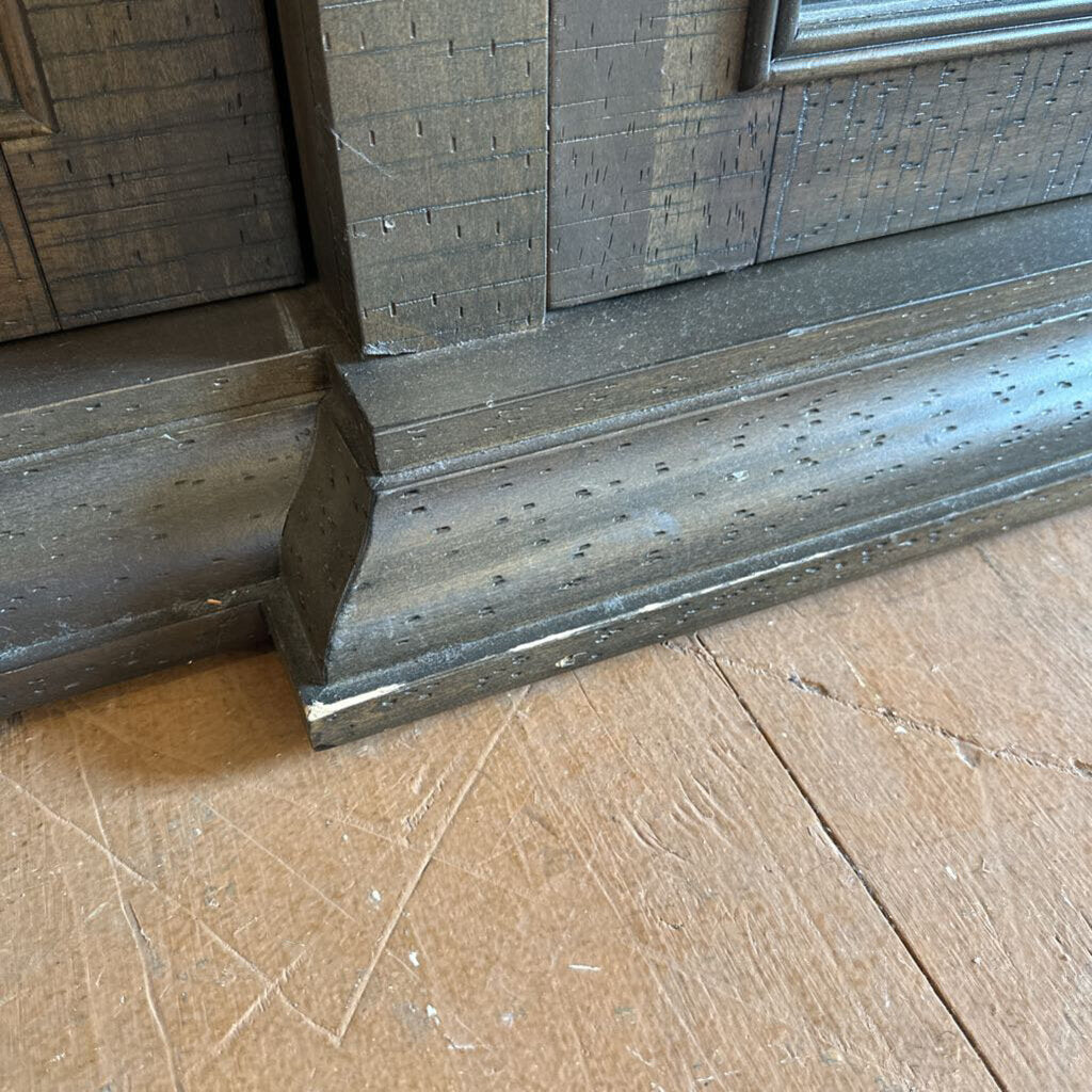 Close-up of a wooden door threshold with a wooden floor.
