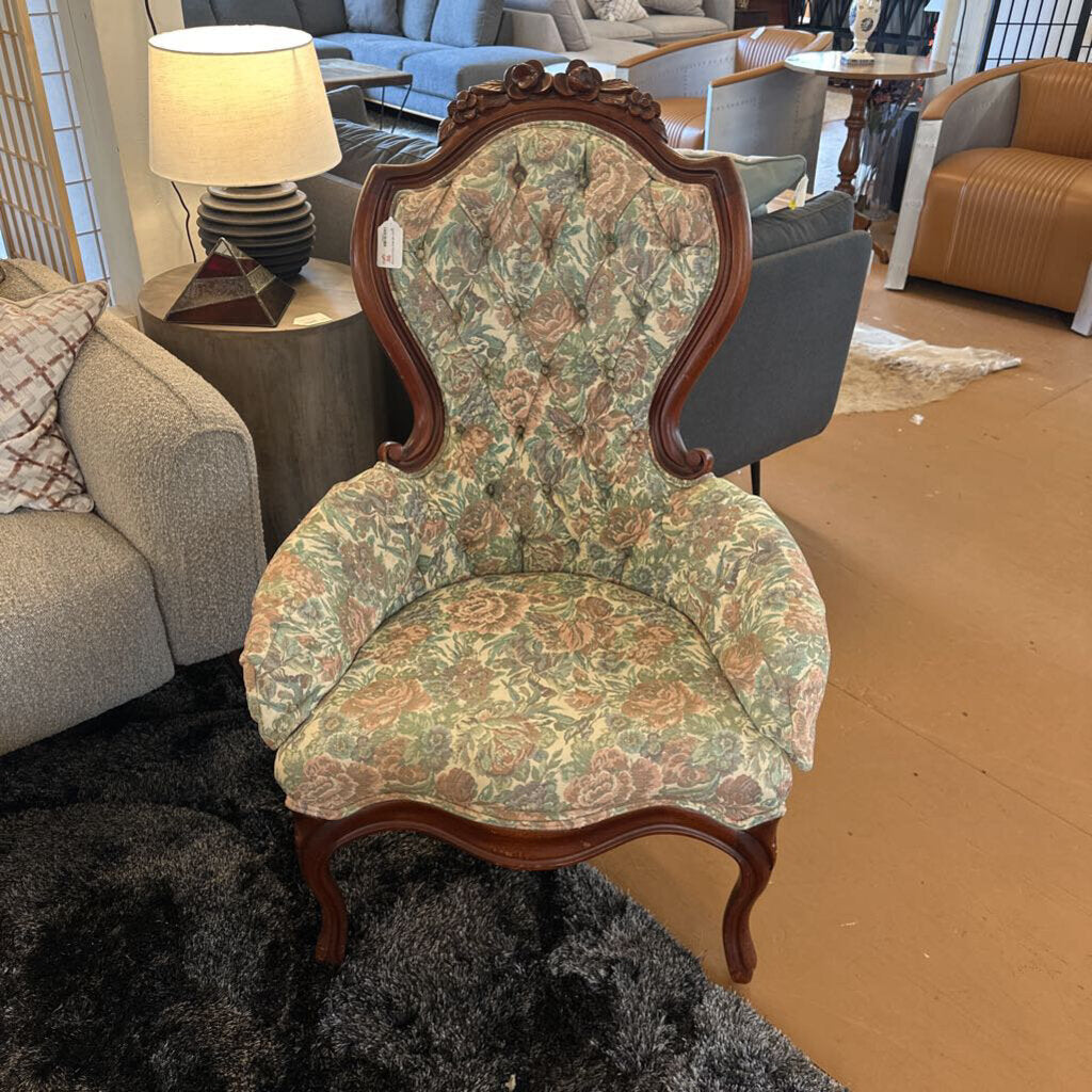 Decorative armchair with floral pattern in a room setting