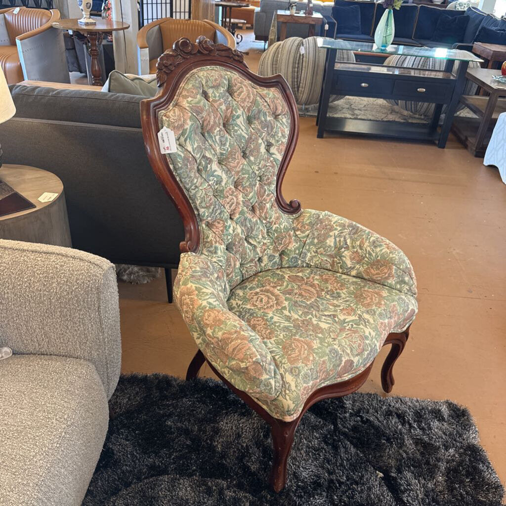 Decorative chair with floral pattern in a furniture store setting