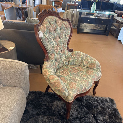 Decorative chair with floral pattern in a furniture store setting