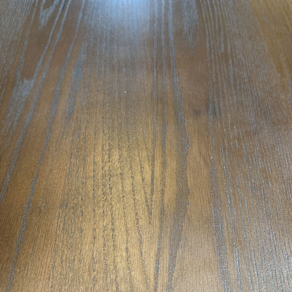 Close-up of a wooden surface with visible grain and texture