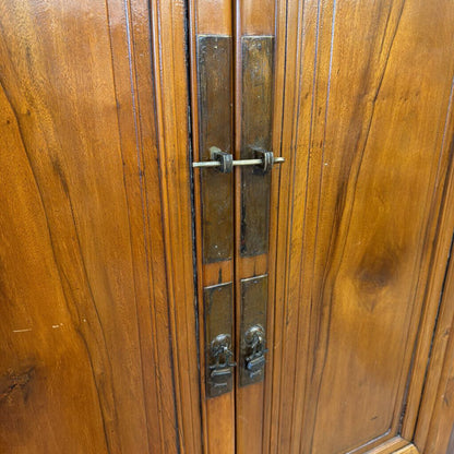 Close-up of a wooden door with metal handles and lock