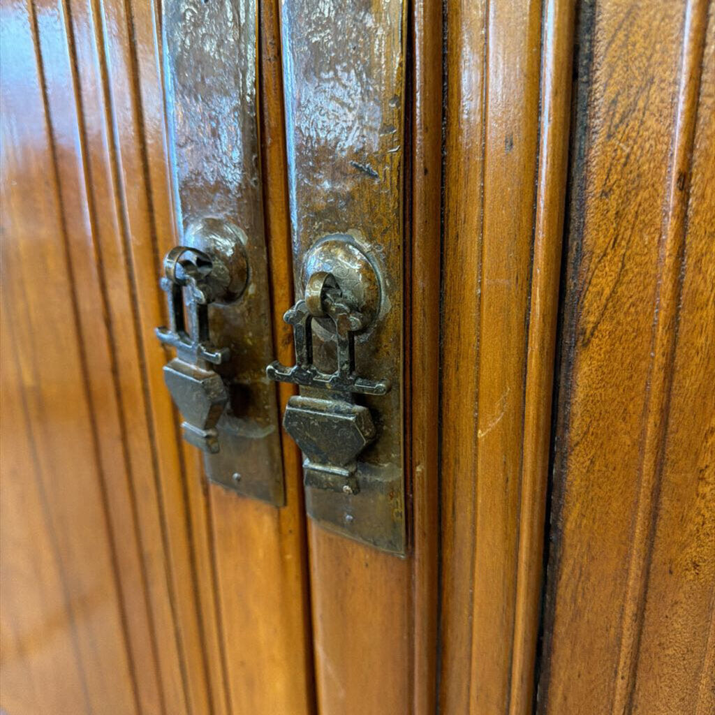 Close-up of wooden cabinet with metal handles
