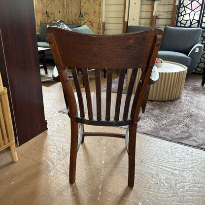 Wooden chair in a room with furniture and decor