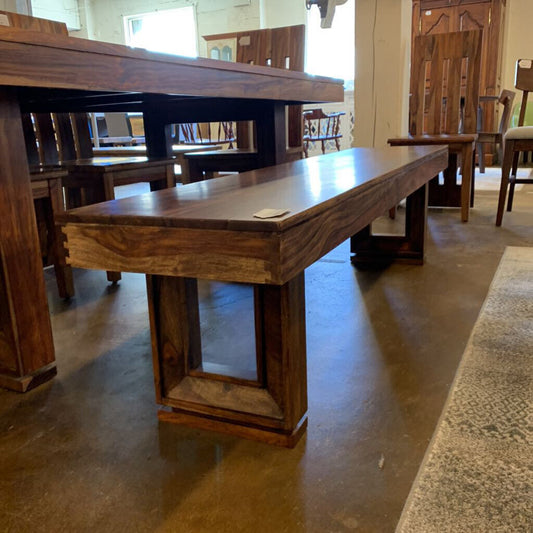 Wooden dining table in a showroom setting