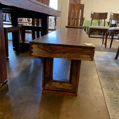 Wooden dining table in a showroom setting
