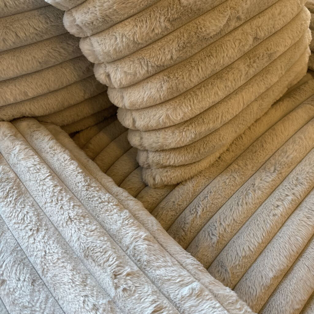 Stack of beige towels with a textured surface