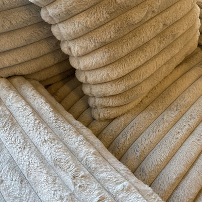 Stack of beige towels with a textured surface