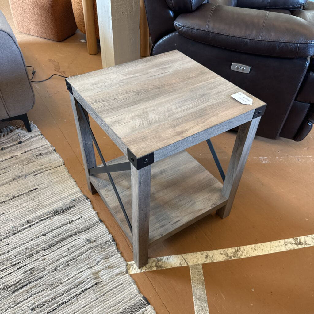 Wooden side table with metal legs in a living room setting