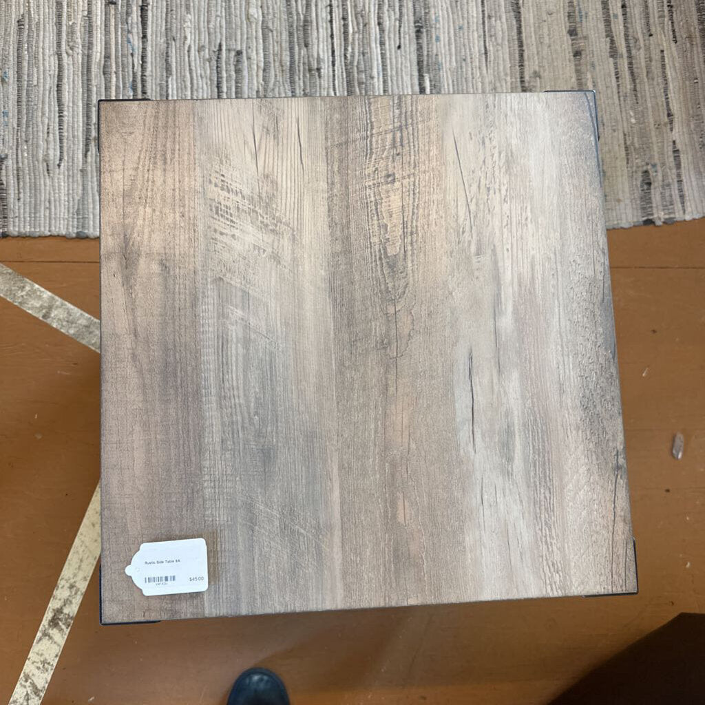 Wooden floor sample with a label on a textured surface