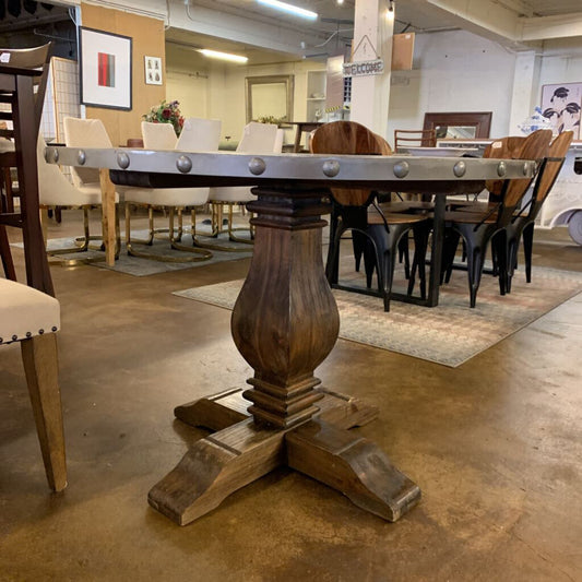 Dining room with wooden table and chairs in a showroom setting