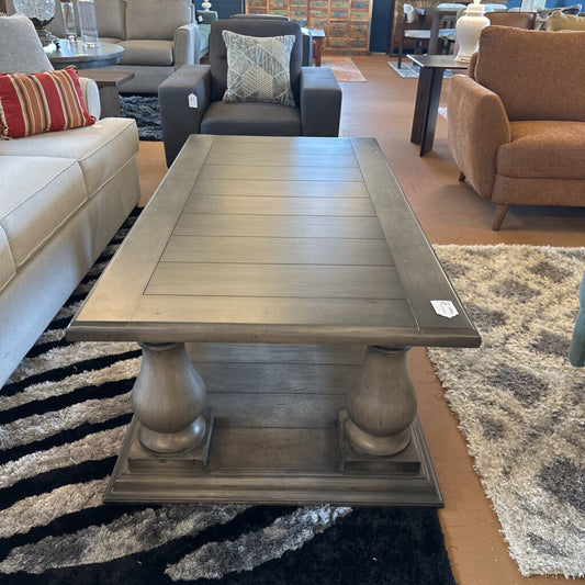 Wooden coffee table in a room with furniture and decor