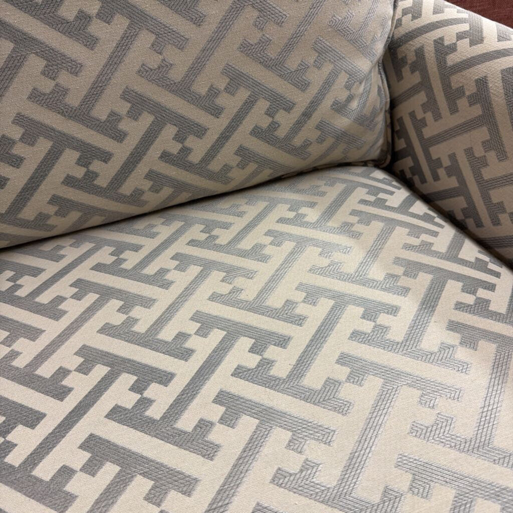 Close-up of a patterned sofa with geometric design