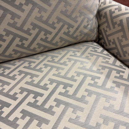 Close-up of a patterned sofa with geometric design