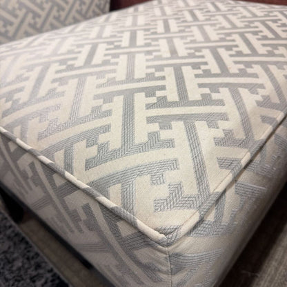 Patterned cushion on a piece of furniture with a geometric design.