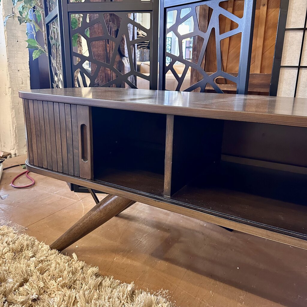 Wooden TV stand with metal frame on a wooden floor