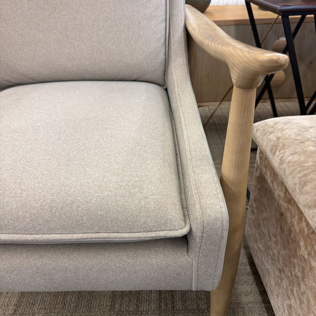 Gray sofa with wooden legs in a room setting