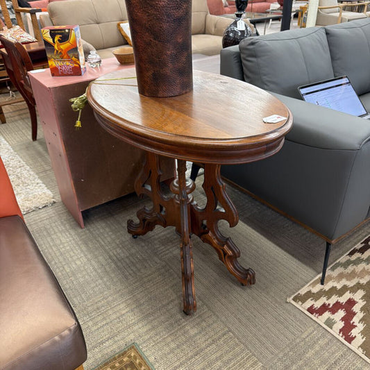 Wooden side table in a room with furniture and decor