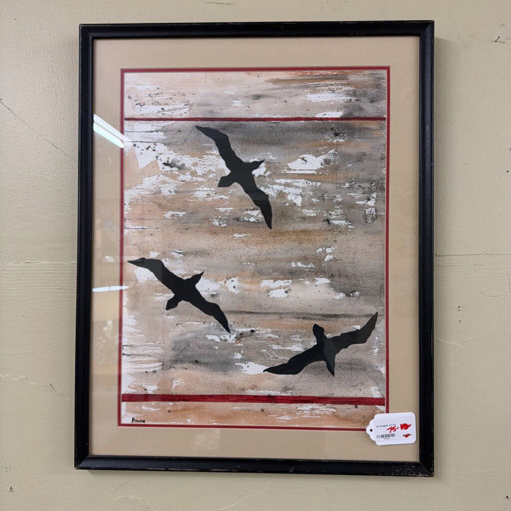Framed abstract art with black bird silhouettes on a textured beige background