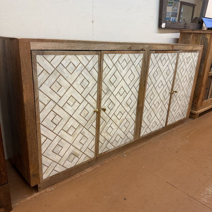 Wooden cabinet with patterned glass doors in a room setting