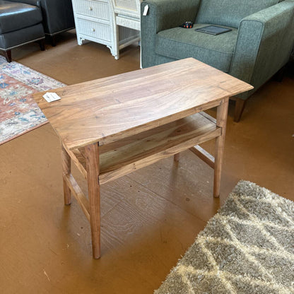 Wooden coffee table in a room with furniture and flooring.