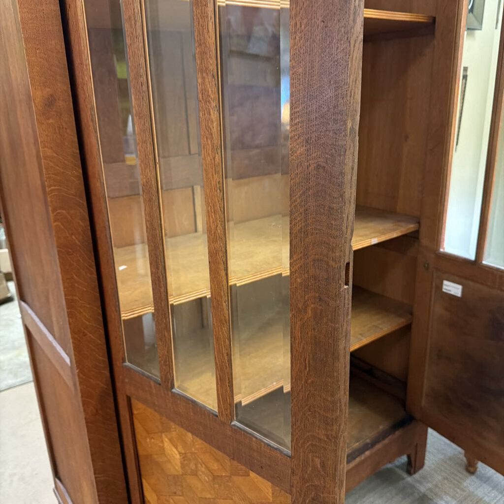 Wooden cabinet with glass doors in a room setting