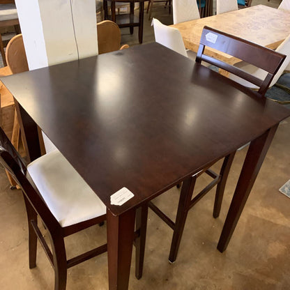 Dining table with chairs in a store setting