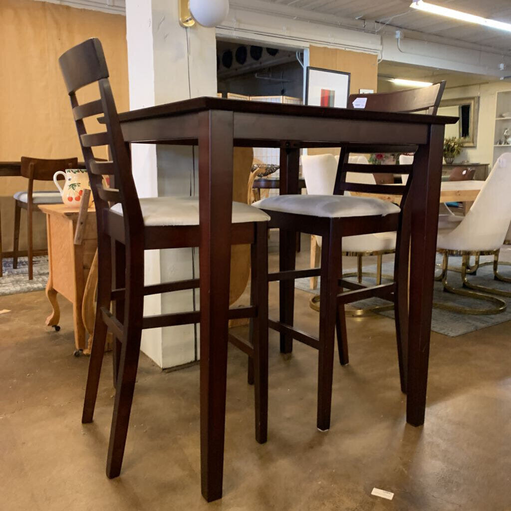 Wooden dining table with chairs in a showroom setting