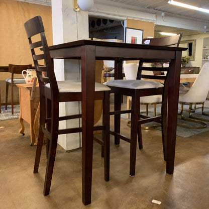Wooden dining table with chairs in a showroom setting