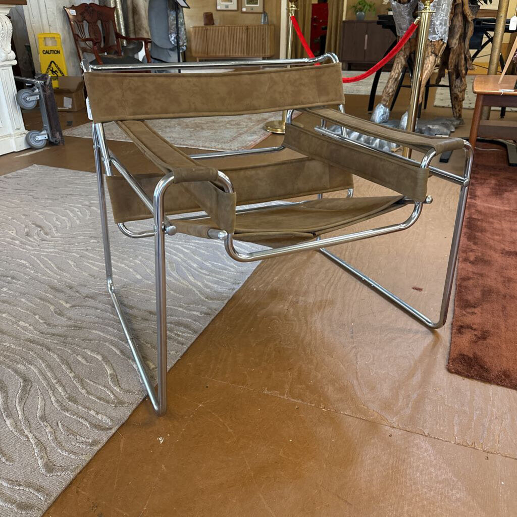 Brown chair with metal frame on a brown floor